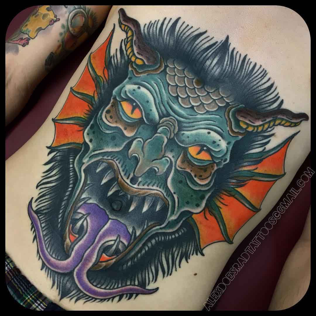 stomach tattoo demon